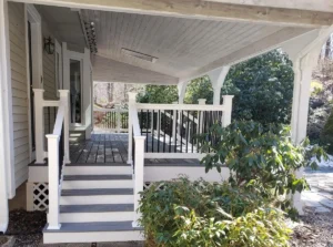 Photo of a deck that is Trex "Transcend" Island Mist/black spindle PVC railings