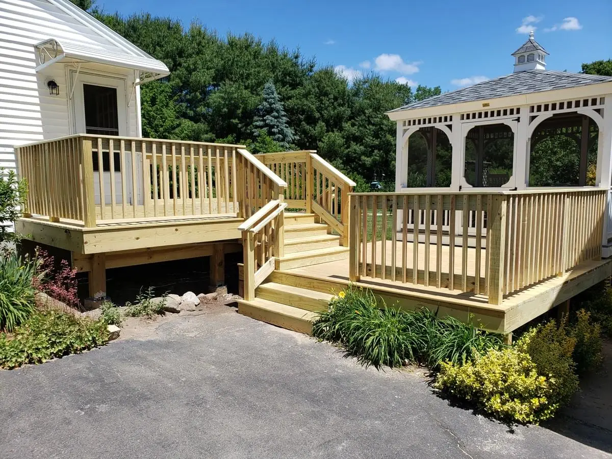 Photo of a deck that is Two level all-wood deck connecting to an existing Gazebo