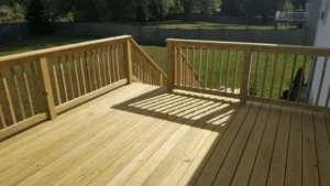 Photo of a deck that is 12'x24' second story deck with fully framed screened room clad in T-111