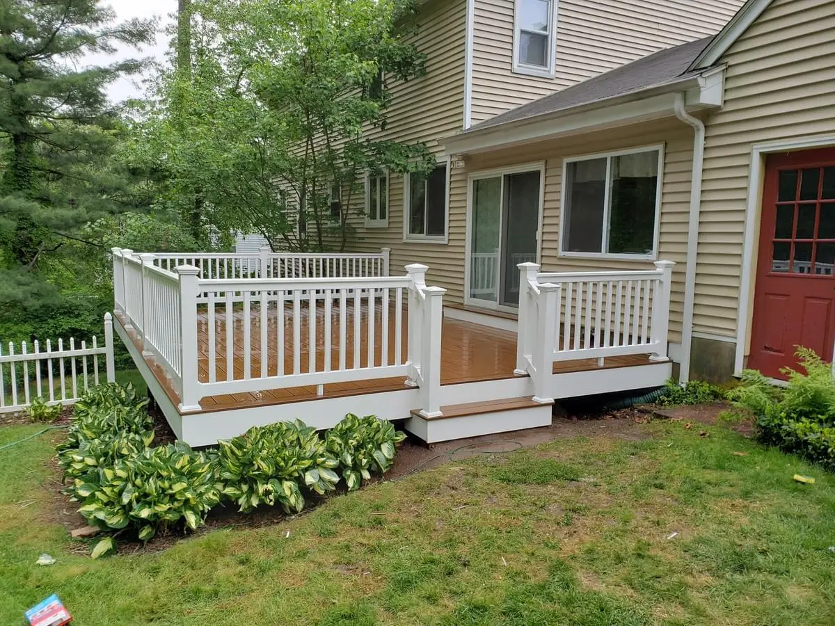Completed Trex Saddle Brown composite deck, vinyl railings in CT
