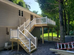 Vinyl railing system and wood second story deck and stairs with platform