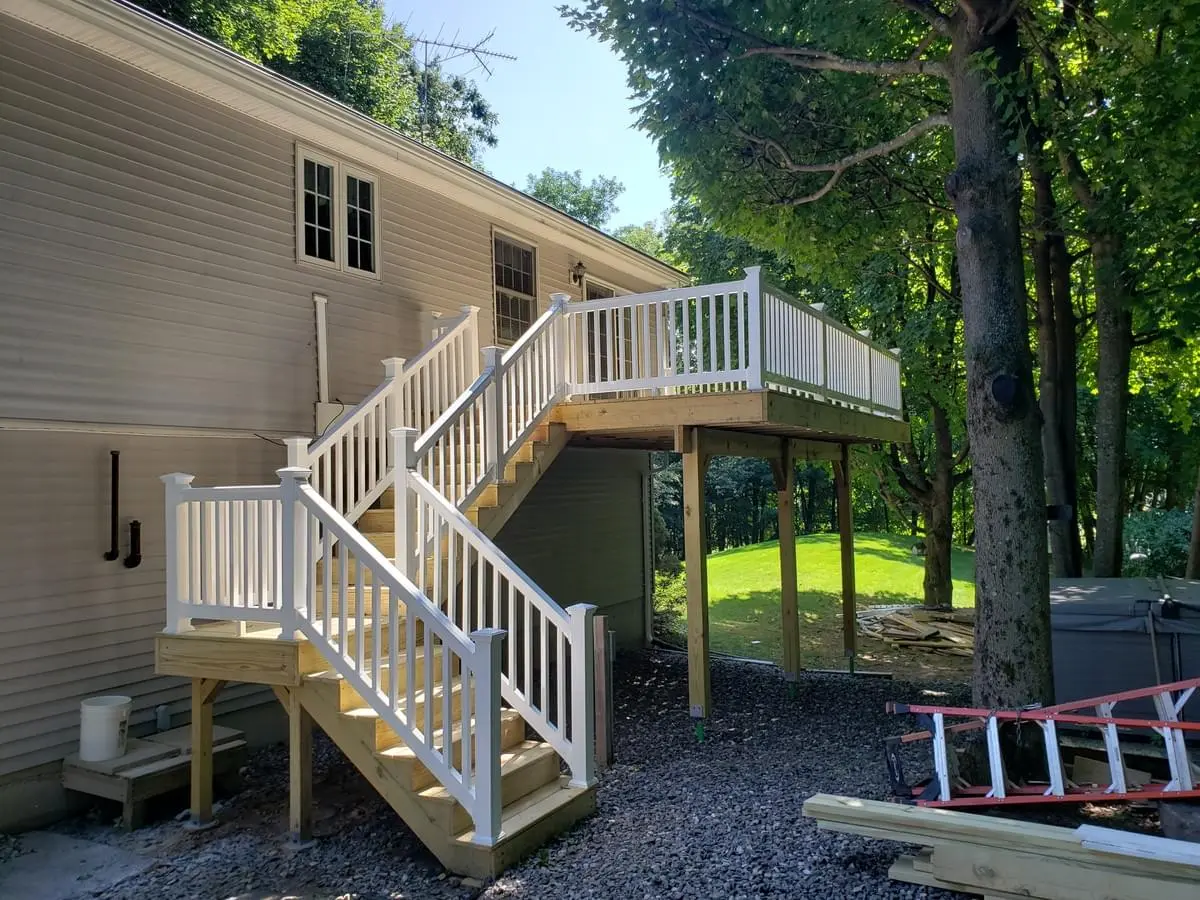 Vinyl railing system and wood second story deck and stairs with platform