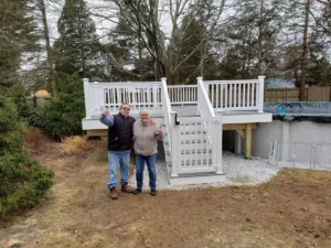 Trex Pebble Gray pool deck with 48" gate lock self-closing hinges vinyl railings PVC rim, risers and stringers and happy deck owners