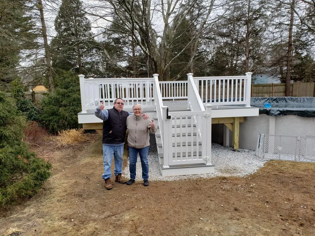 Trex Pebble Gray pool deck with 48" gate lock self-closing hinges vinyl railings PVC rim, risers and stringers and happy deck owners